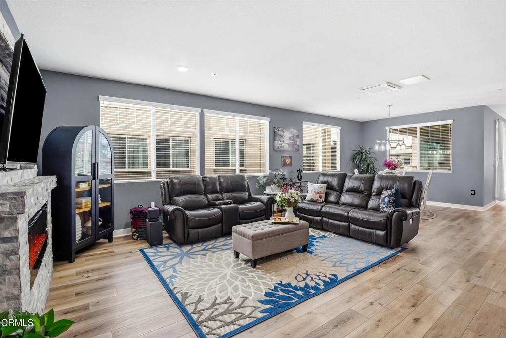 2820 Wagon Wheel Road, Unit 403 Oxnard, CA 93036 - Photo 11 of 35 a living room with furniture and a flat screen tv