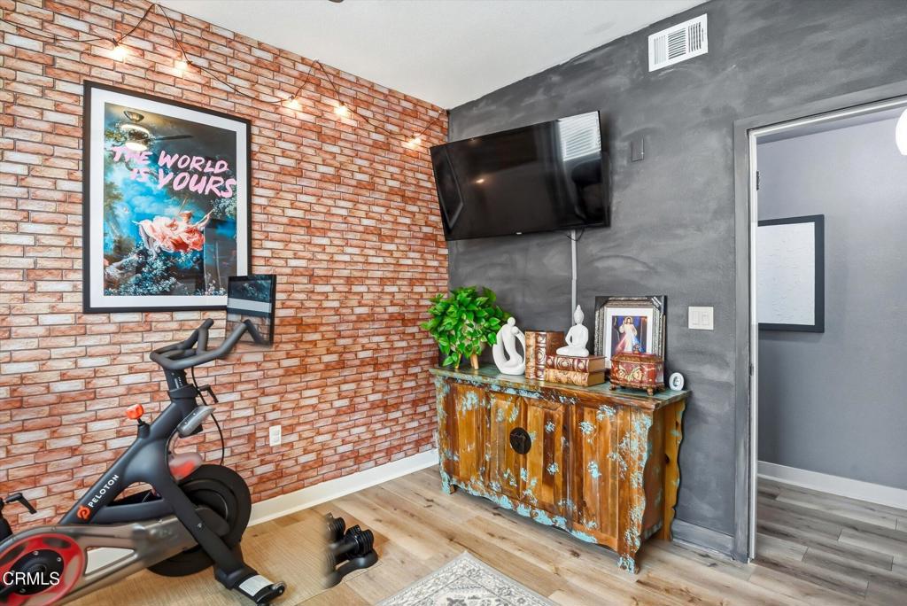 2820 Wagon Wheel Road, Unit 403 Oxnard, CA 93036 - Photo 26 of 35 a view of a living room with a flat screen tv and floor to ceiling window