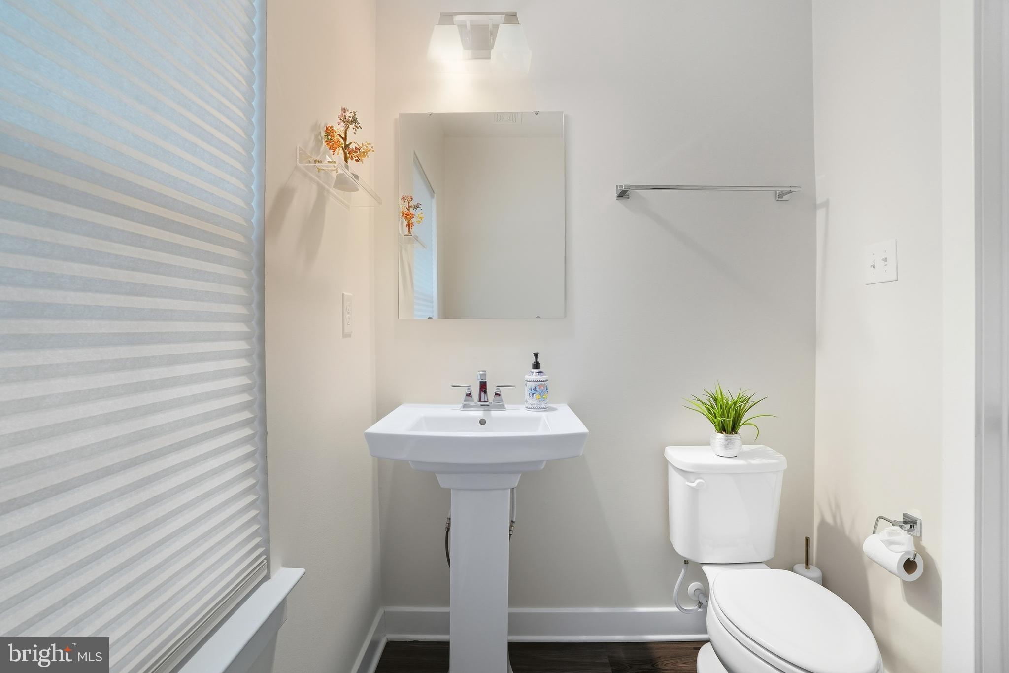 214 Pixie Moss Road Pottstown, PA 19464 - Photo 14 of 27 a bathroom with a sink toilet and a mirror