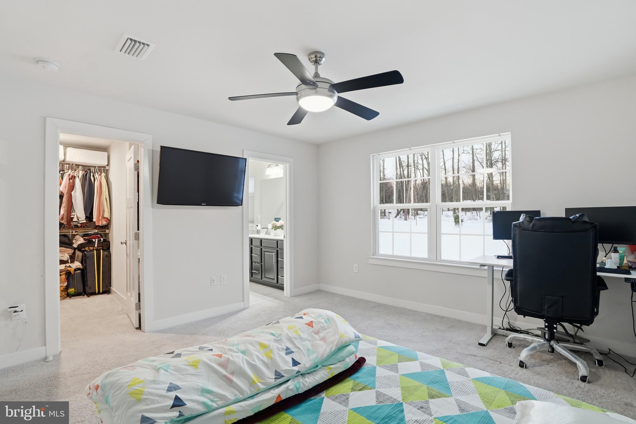 214 Pixie Moss Road Pottstown, PA 19464 - Photo 16 of 27 a bedroom with a bed and a flat screen tv