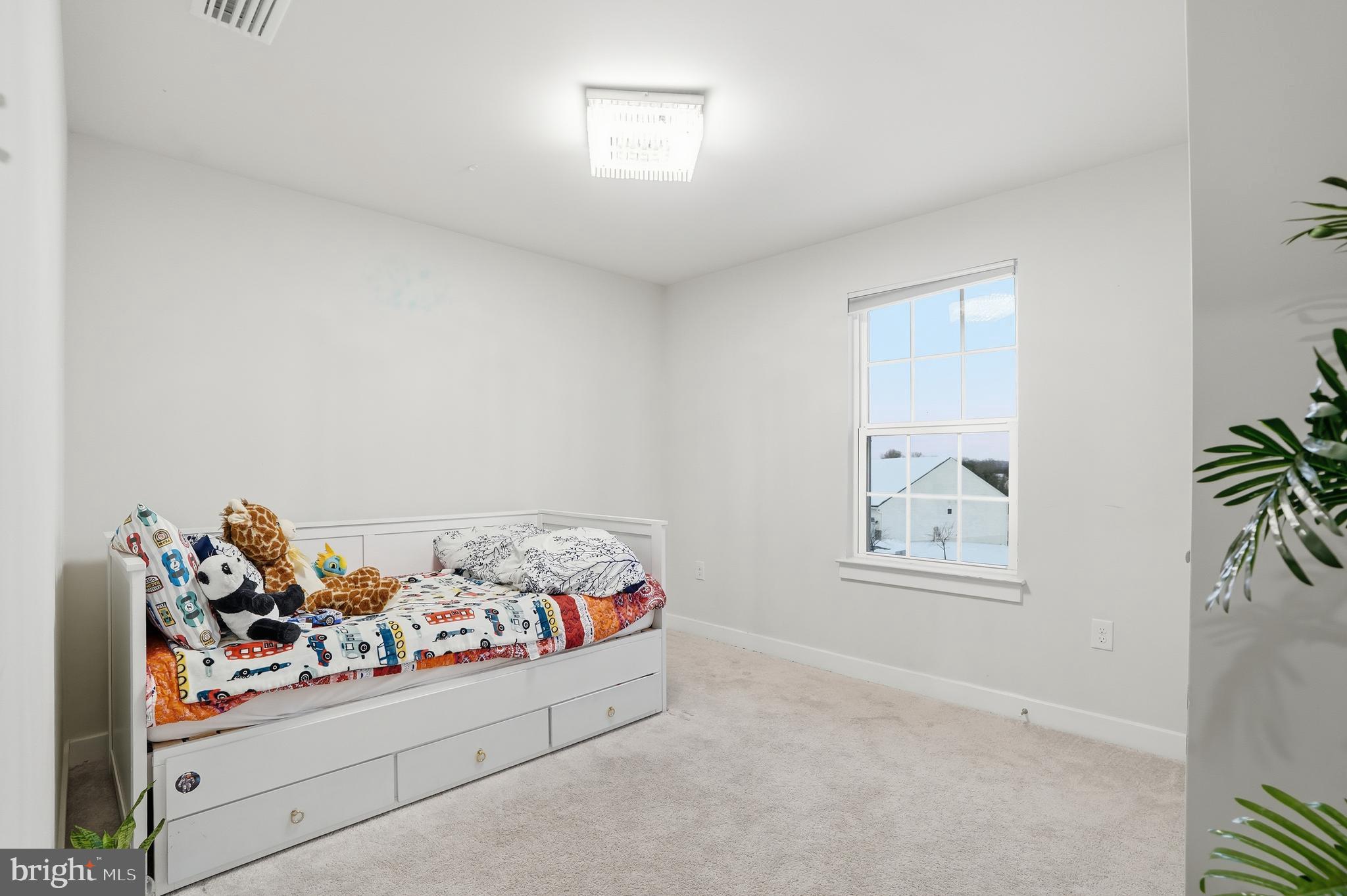 214 Pixie Moss Road Pottstown, PA 19464 - Photo 18 of 27 a bed room with furniture and a window