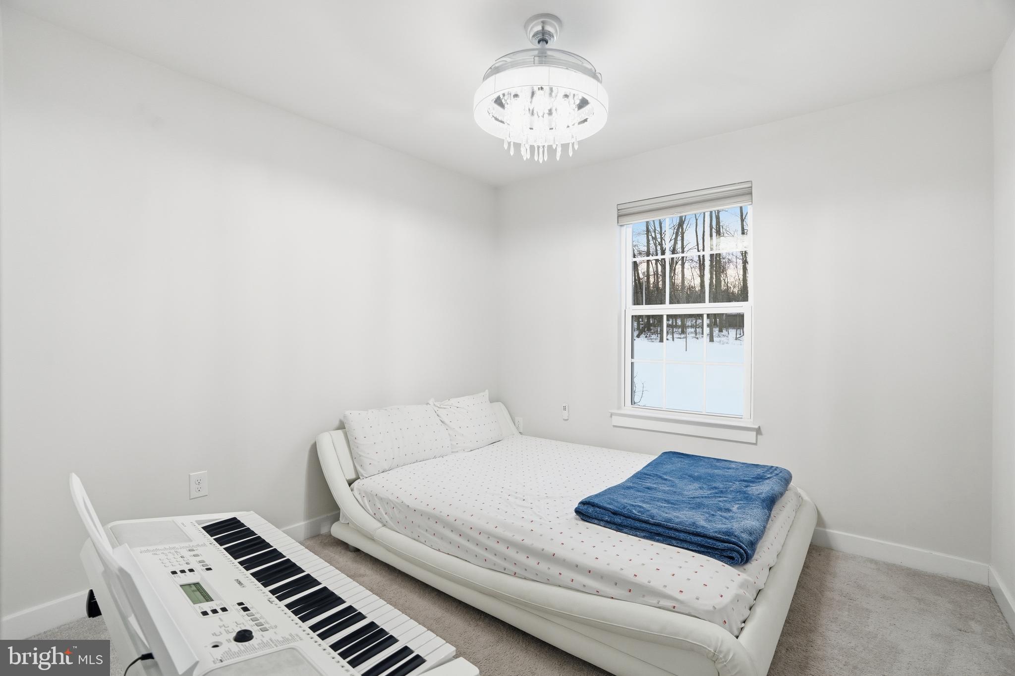 214 Pixie Moss Road Pottstown, PA 19464 - Photo 21 of 27 a bedroom with a bed and a window