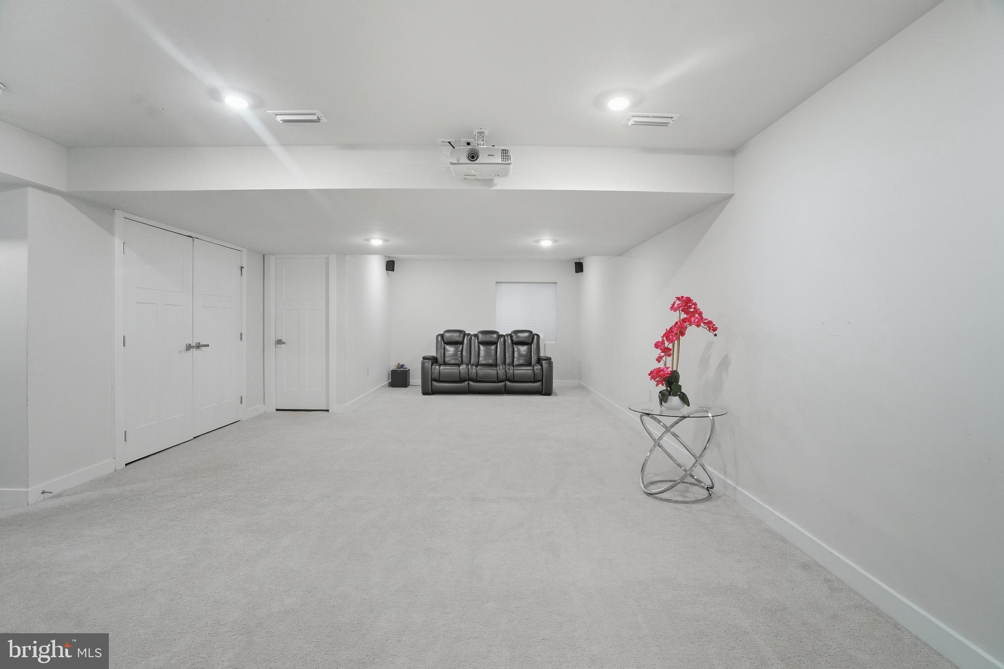 214 Pixie Moss Road Pottstown, PA 19464 - Photo 23 of 27 a view of a room with gym equipment and a chandelier