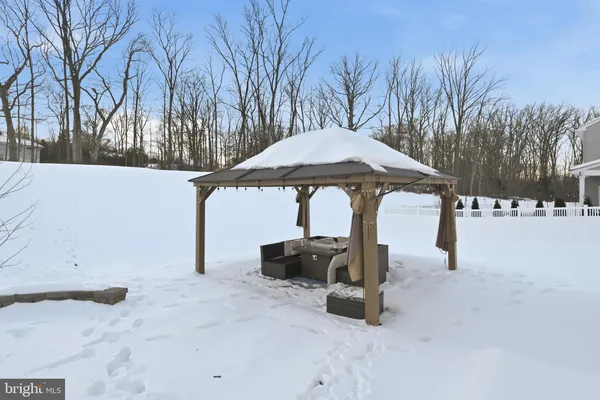 a table and chairs under an umbrella