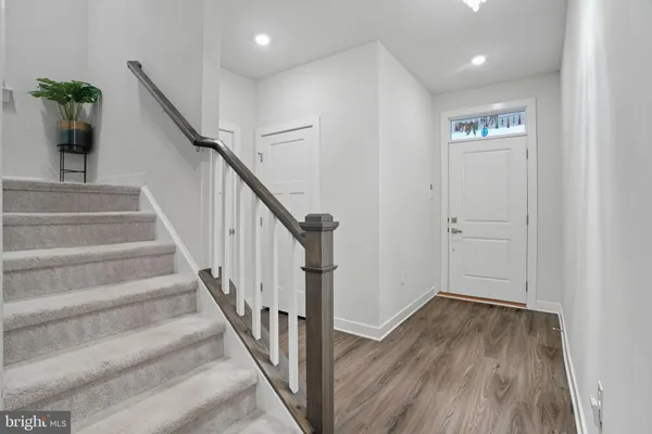 a view of entryway with wooden floor