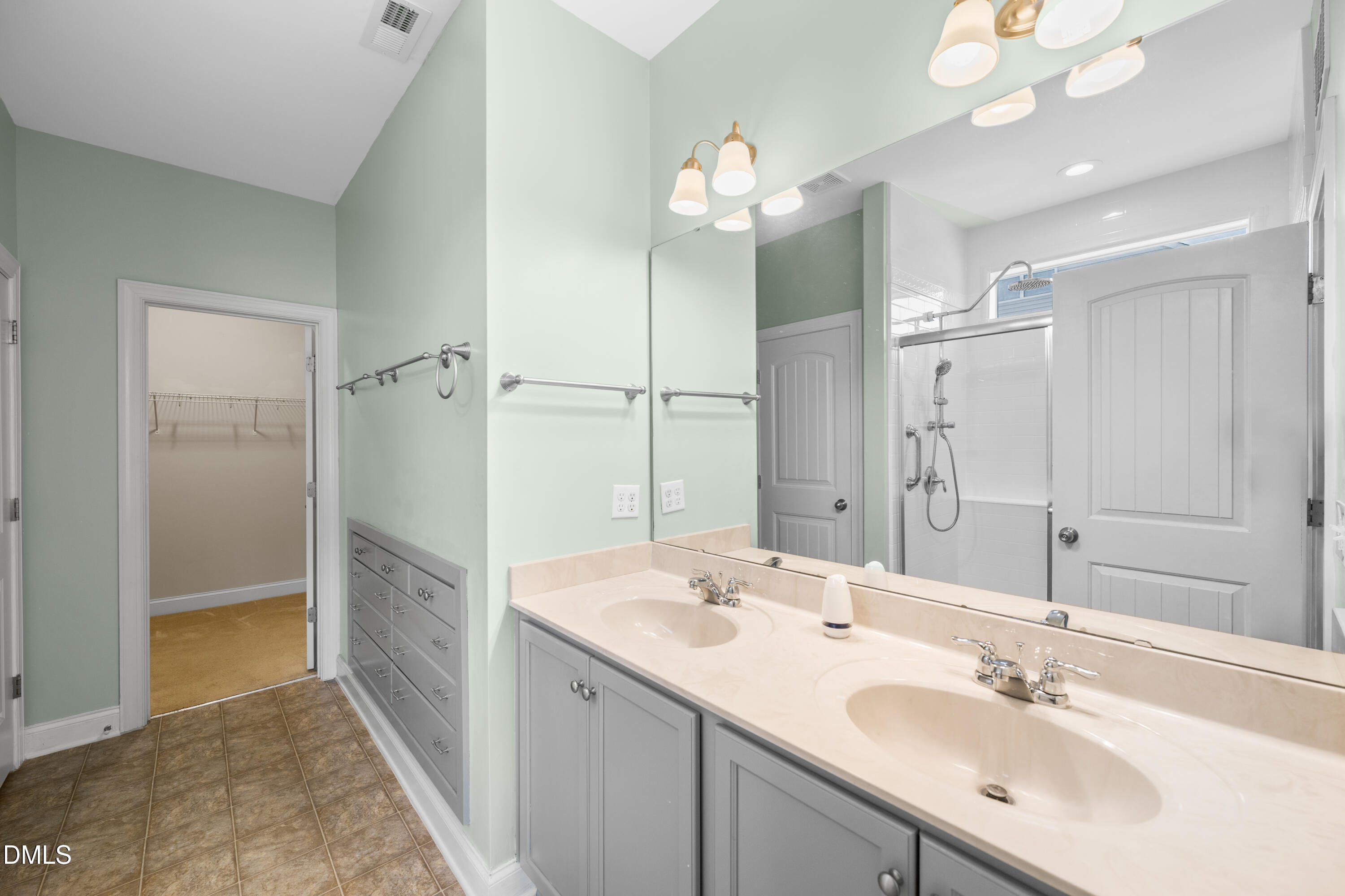 701 Spruce Meadows Lane Willow Spring, NC 27592 - Photo 21 of 54 a bathroom with a sink double vanity and a mirror