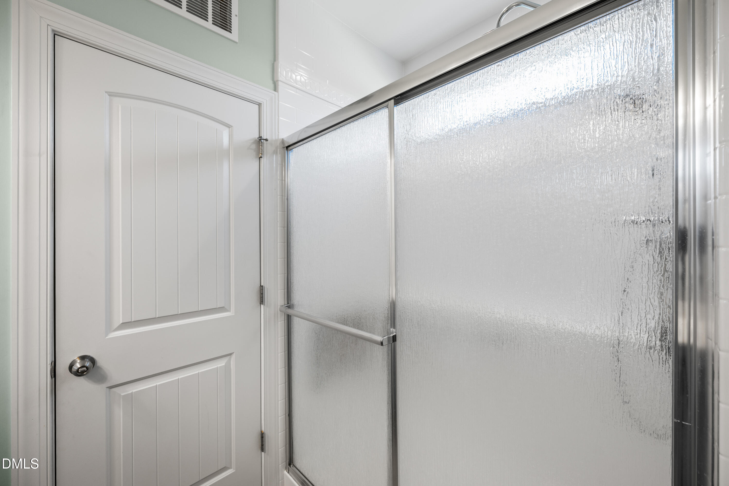701 Spruce Meadows Lane Willow Spring, NC 27592 - Photo 22 of 54 a bathroom with a glass shower door