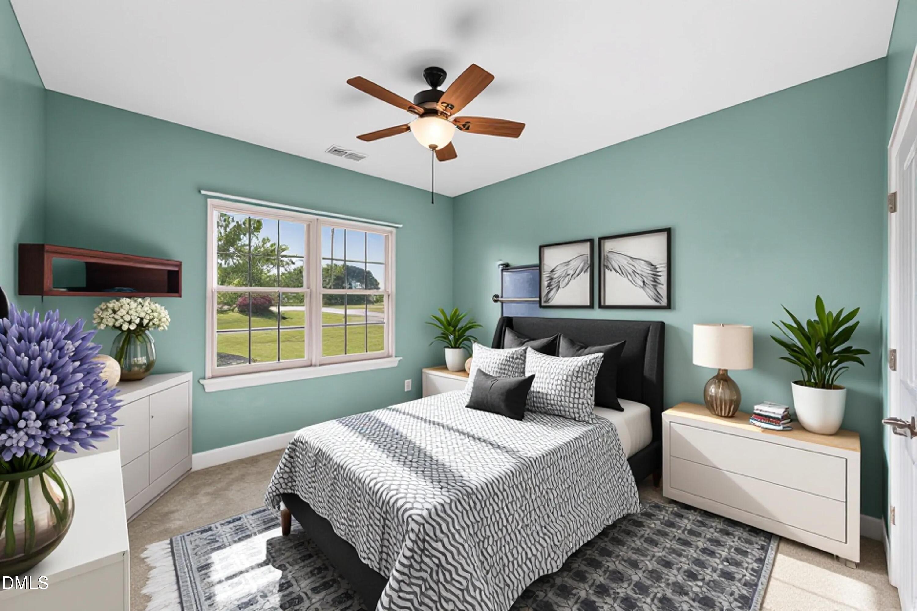 701 Spruce Meadows Lane Willow Spring, NC 27592 - Photo 26 of 54 a bedroom with a large bed and a window