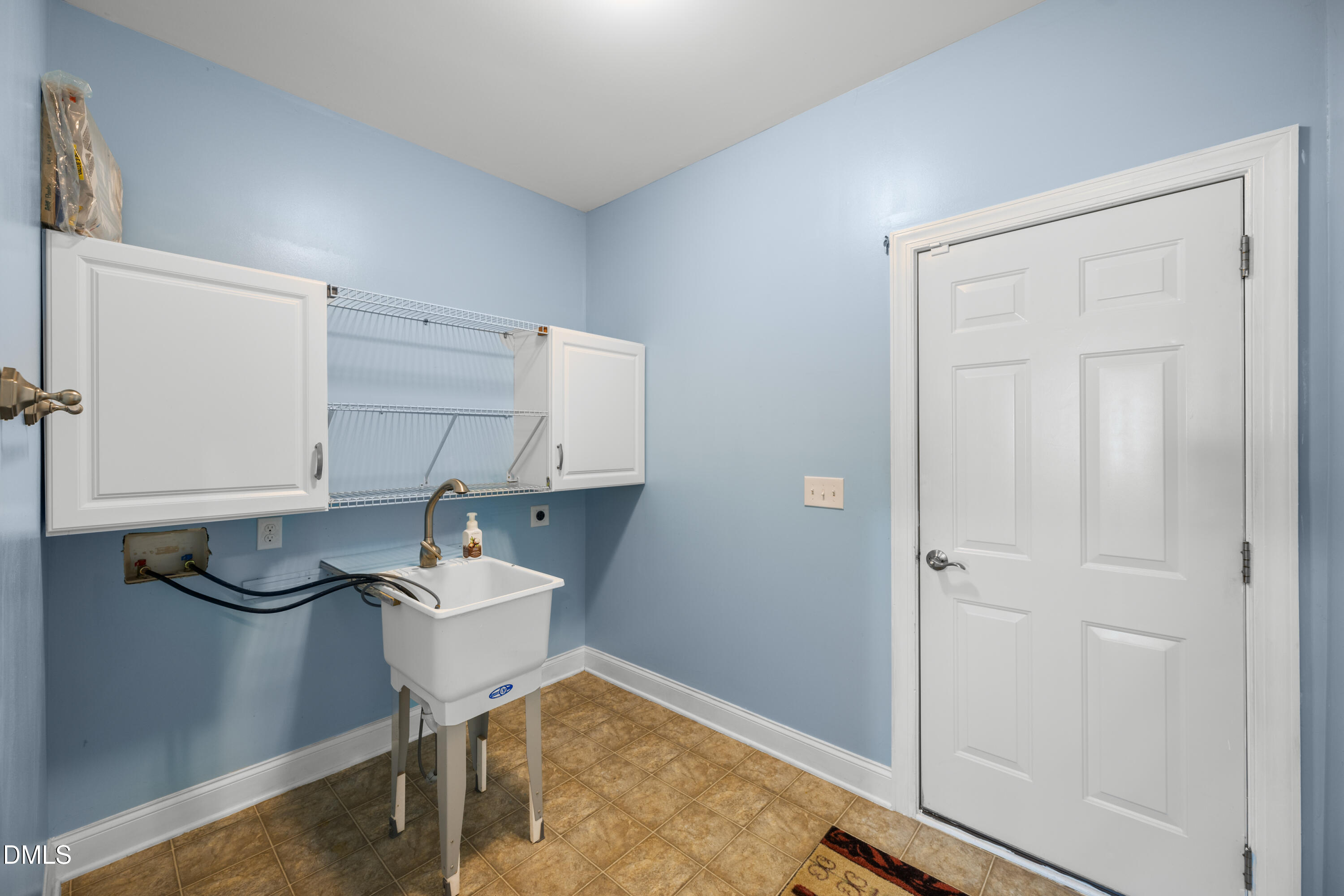 701 Spruce Meadows Lane Willow Spring, NC 27592 - Photo 30 of 54 a room with storage and utility