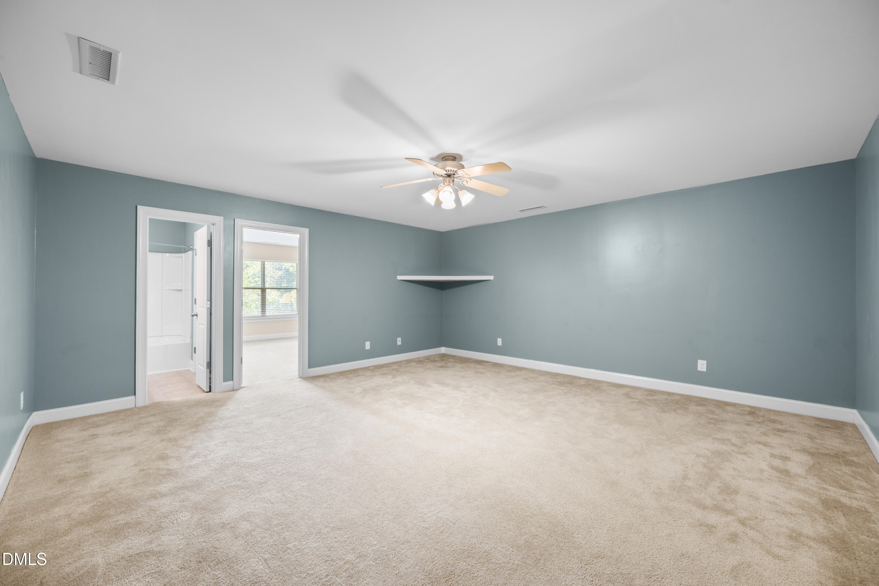 701 Spruce Meadows Lane Willow Spring, NC 27592 - Photo 31 of 54 a view of an empty room with a window