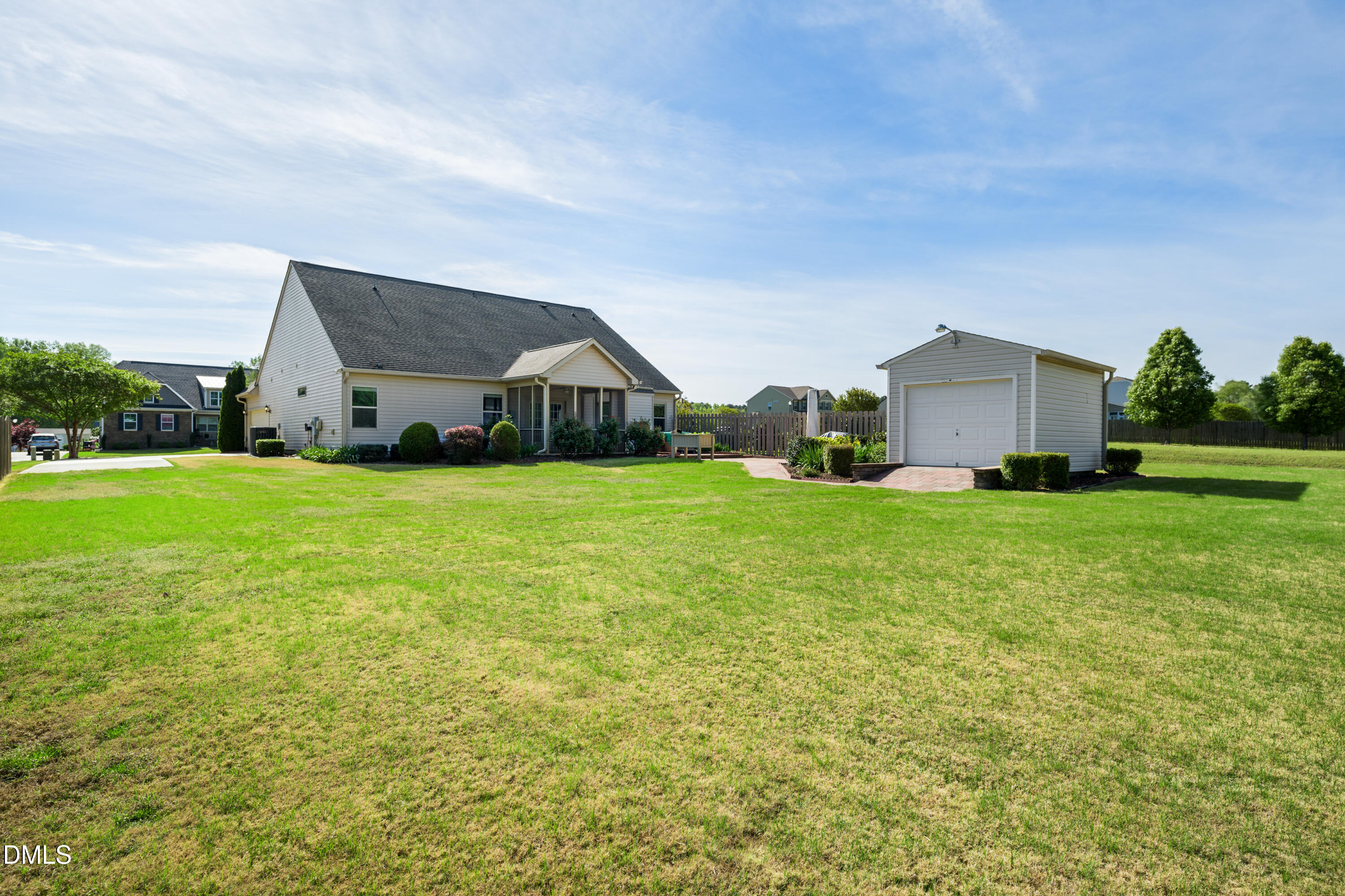 701 Spruce Meadows Lane Willow Spring, NC 27592 - Photo 40 of 54 a view of a house with a big yard and large trees