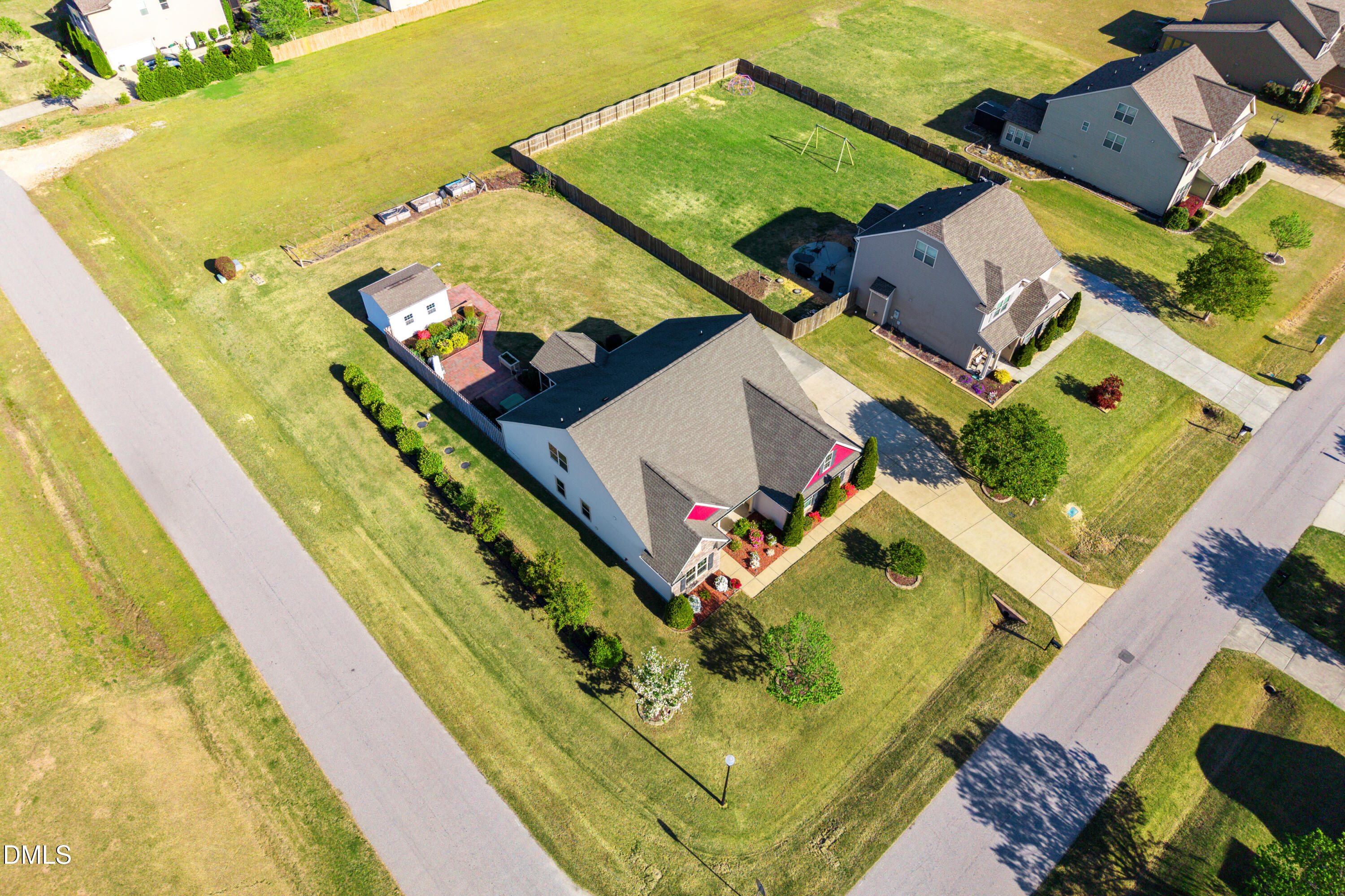 701 Spruce Meadows Lane Willow Spring, NC 27592 - Photo 43 of 54 an aerial view of a house with a yard