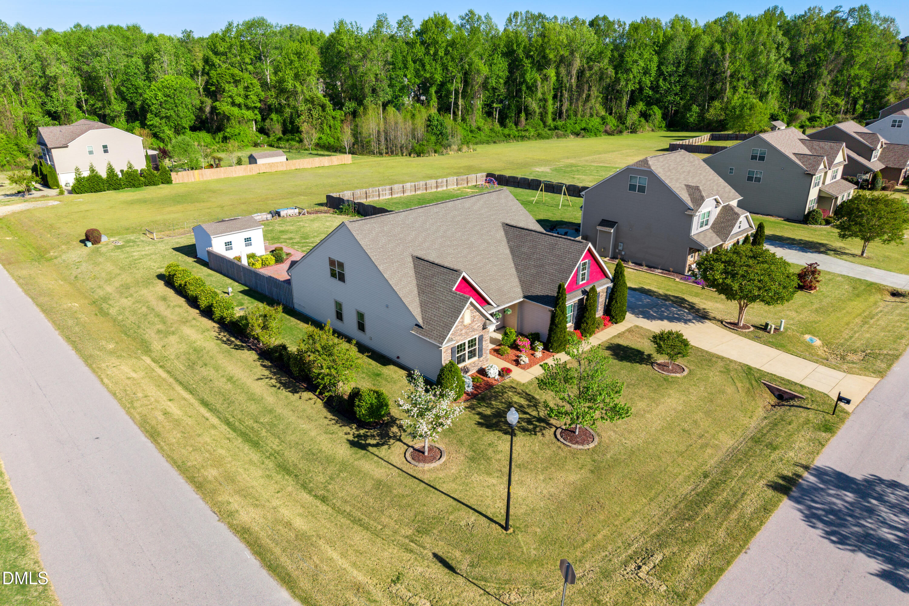701 Spruce Meadows Lane Willow Spring, NC 27592 - Photo 51 of 54 an aerial view of a house with a yard