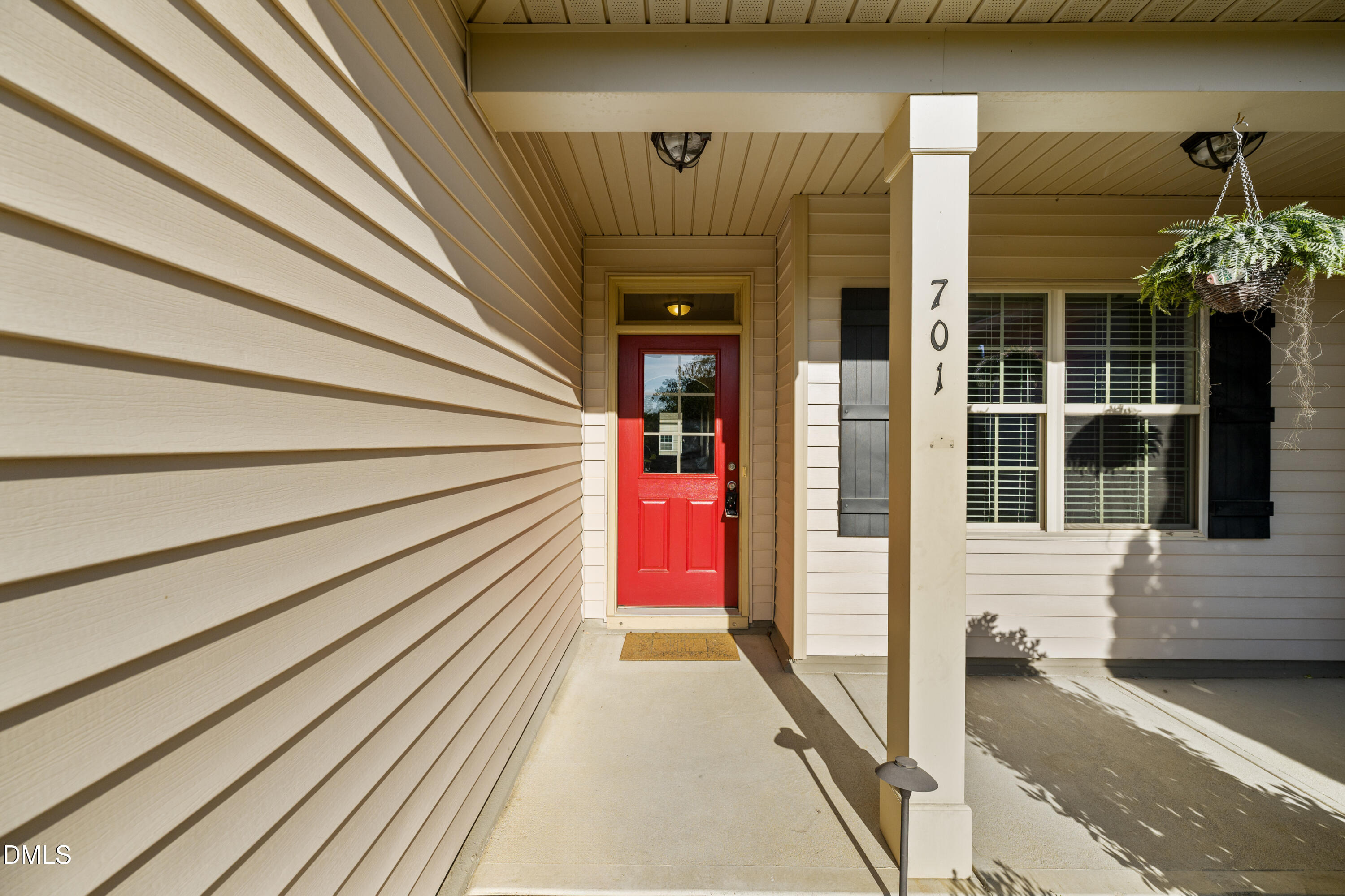 701 Spruce Meadows Lane Willow Spring, NC 27592 - Photo 4 of 54 a view of a entryway door front of house