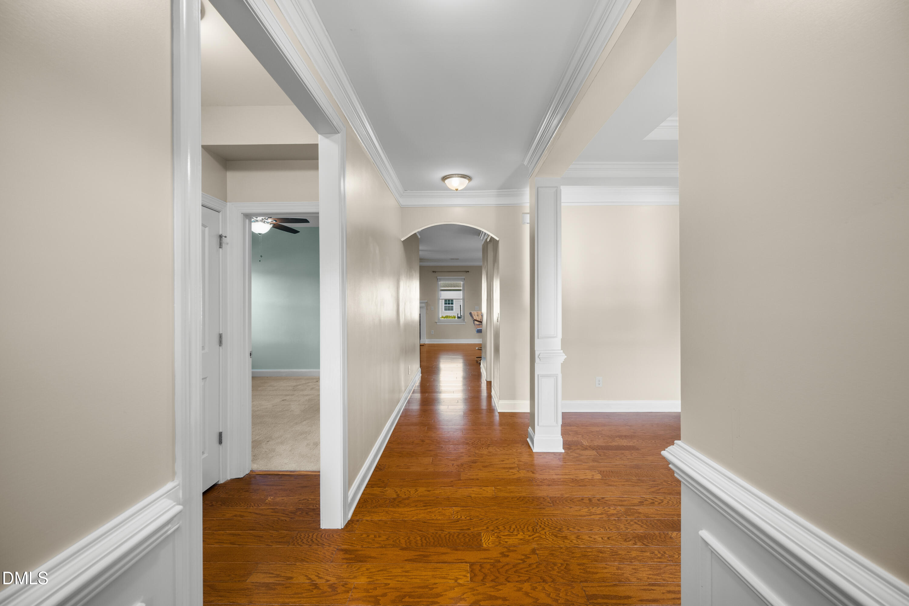 701 Spruce Meadows Lane Willow Spring, NC 27592 - Photo 5 of 54 a view of a hallway with wooden floor and a bathroom