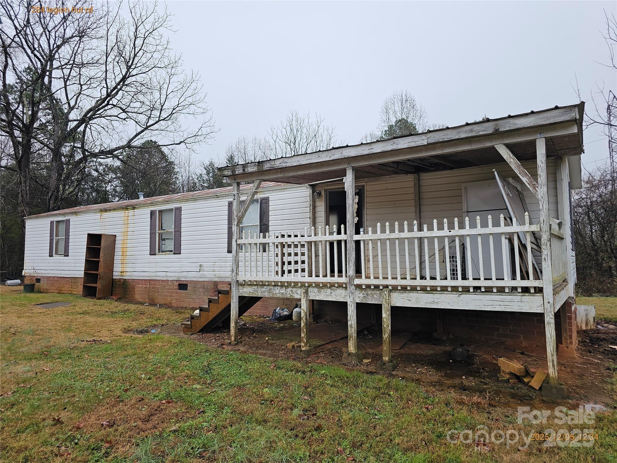 284 Legion Hut Road Mocksville, NC 27028 - Photo 15 of 16 a view of a house with a yard and sitting area