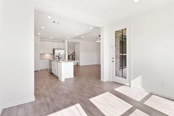 a view of kitchen and wooden floor