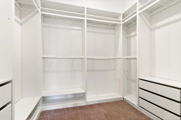 a view of an empty walk in closet