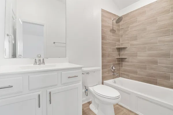 a bathroom with a sink a toilet and a bathtub