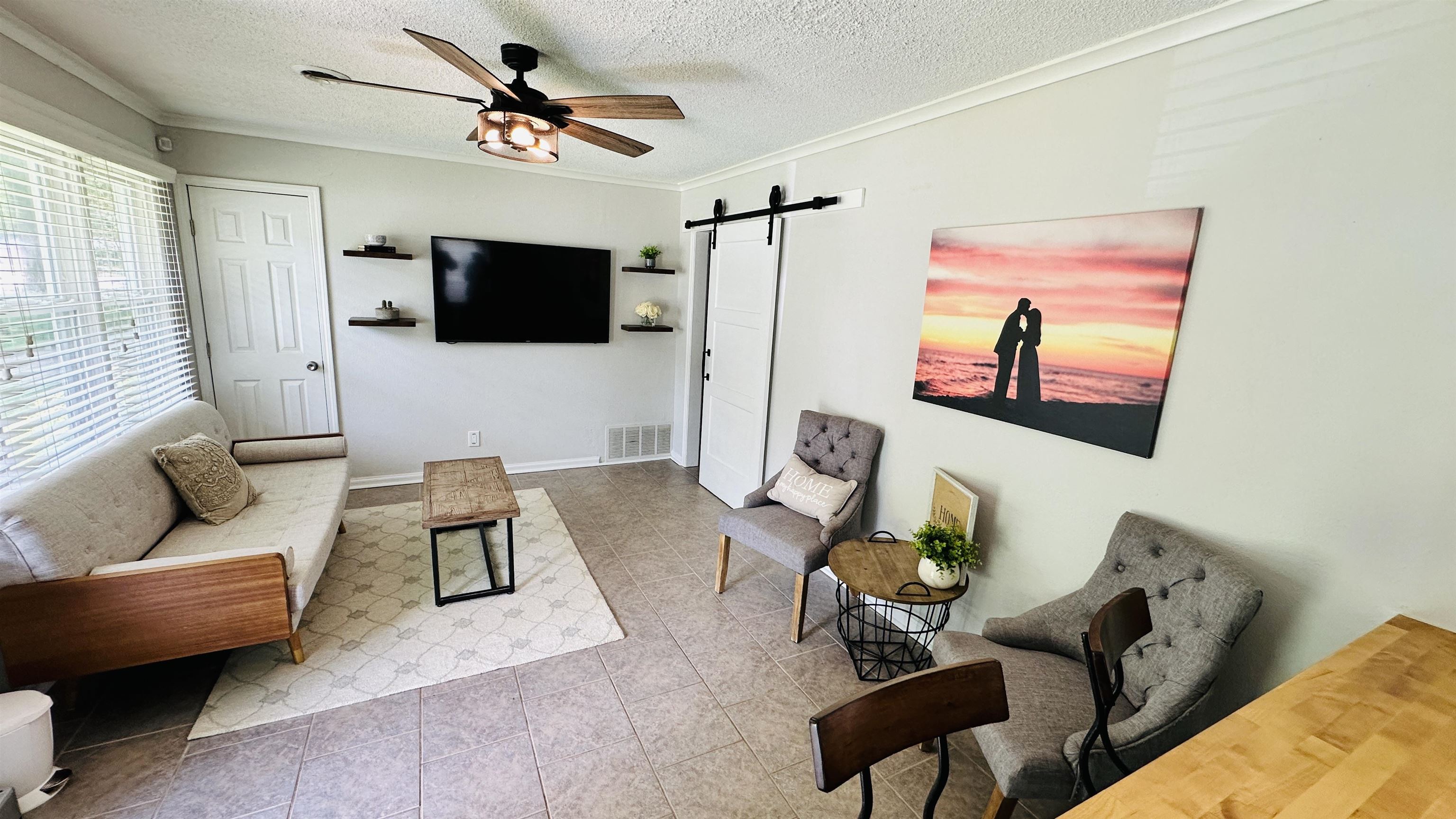 1428 Marcia Road Memphis, TN 38117 - Photo 5 of 14 a living room with furniture and a flat screen tv