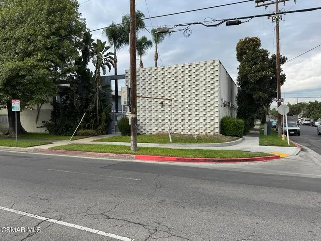 a view of a park with large trees