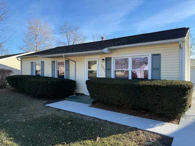 a view of house and yard with green space
