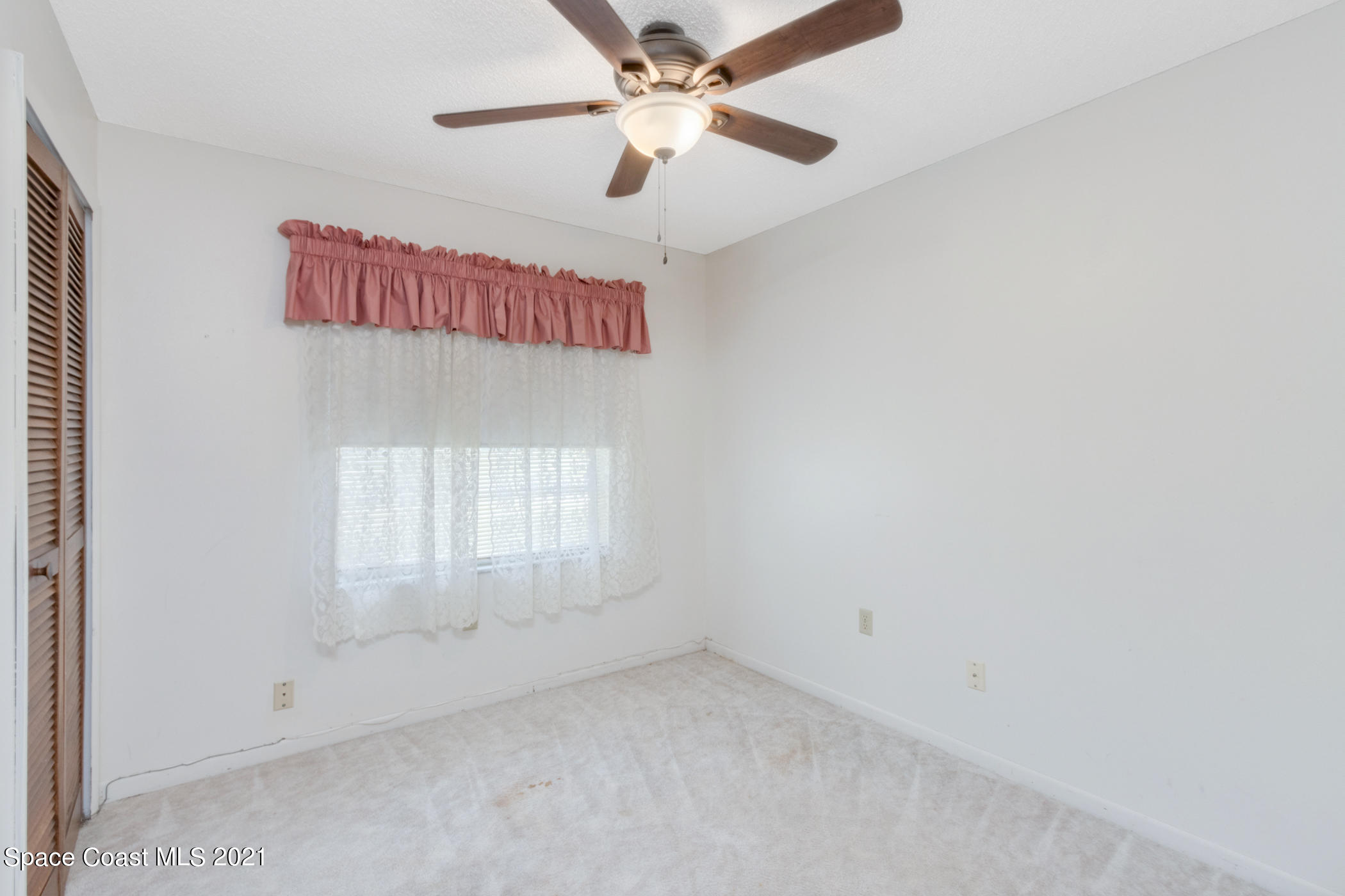 1627 West Shores Road Melbourne, FL 32935 - Photo 14 of 26 Second bedroom