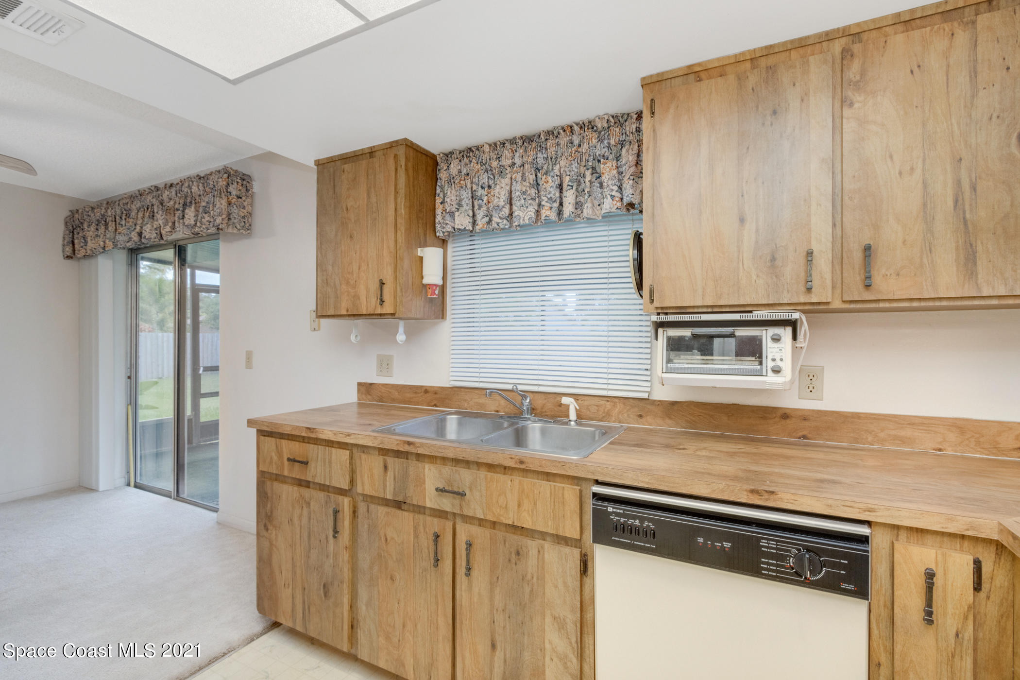 1627 West Shores Road Melbourne, FL 32935 - Photo 10 of 26 Window looks out to the screened porch