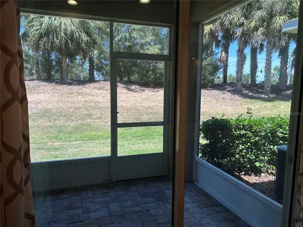 a view of a porch with a yard