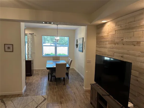 a view of a dining room with furniture window and outside view