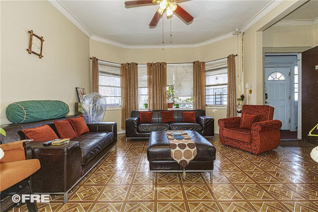 479 East 8th Street Brooklyn, NY 11218 - Photo 3 of 15 a living room with furniture and a large window