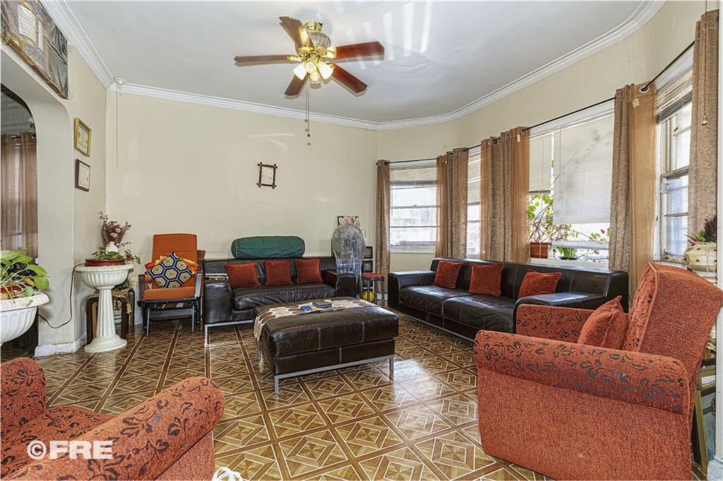 479 East 8th Street Brooklyn, NY 11218 - Photo 4 of 15 a living room with furniture or couch and a window