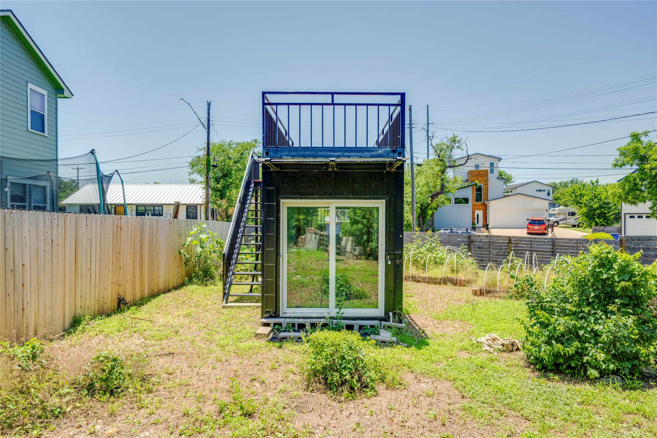 1707 Overhill Drive Austin, TX 78721 - Photo 27 of 36 A clever shipping container conversion offers a private rooftop deck and an outdoor staircase.