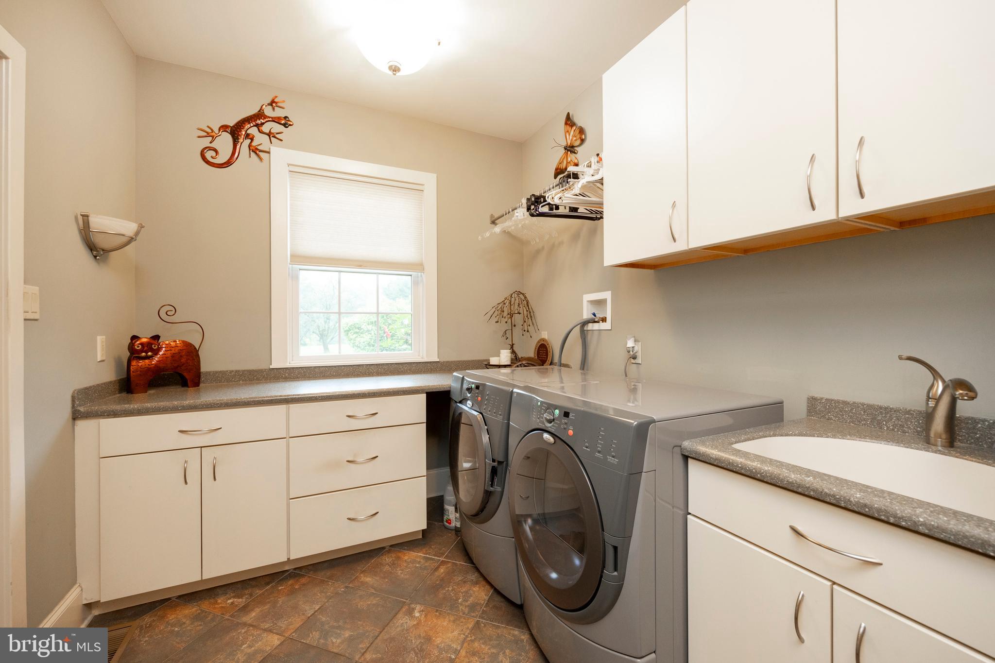 1720 St Peters Road Pottstown, PA 19465 - Photo 17 of 65 a utility room with cabinets washer and dryer