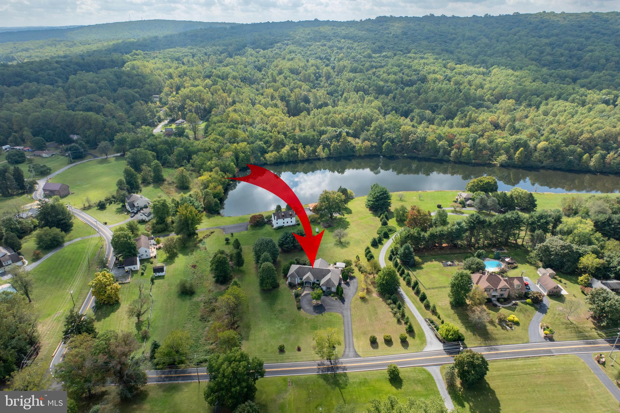 1720 St Peters Road Pottstown, PA 19465 - Photo 2 of 65 an aerial view of a house with a yard and lake view