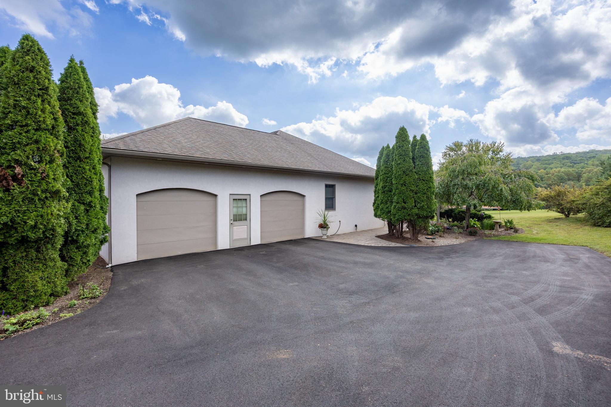 1720 St Peters Road Pottstown, PA 19465 - Photo 40 of 65 a view of a house with a yard and garage
