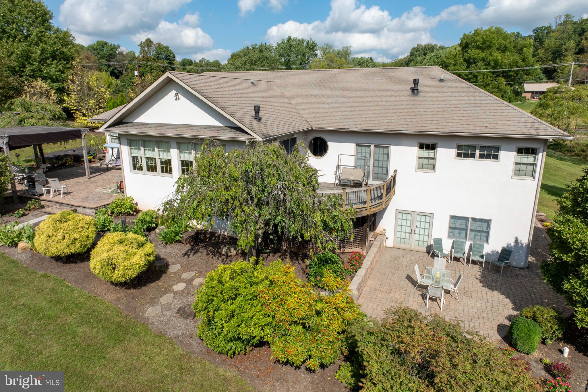 1720 St Peters Road Pottstown, PA 19465 - Photo 45 of 65 an aerial view of a house with a yard and potted plants