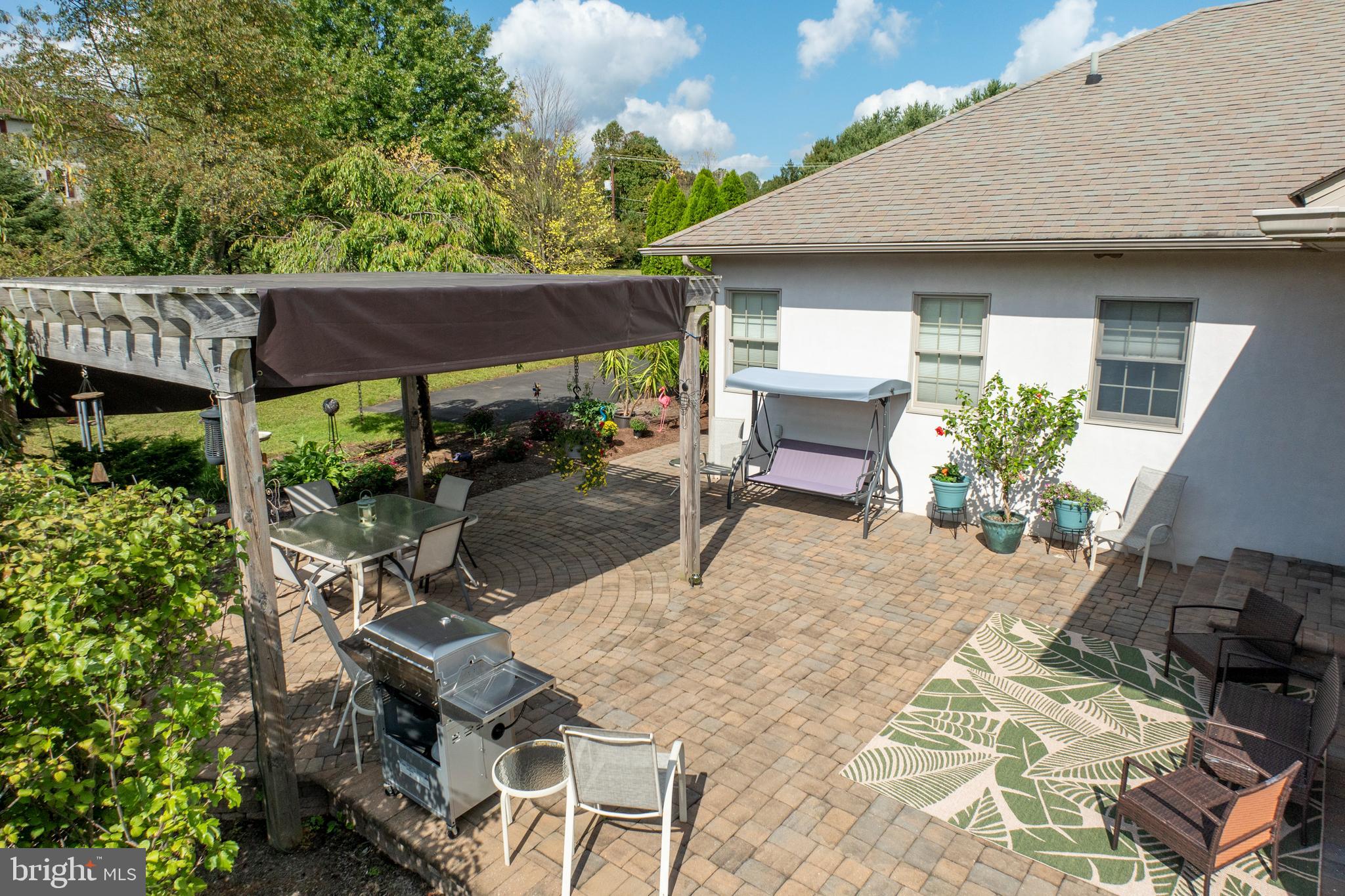 1720 St Peters Road Pottstown, PA 19465 - Photo 46 of 65 a view of a patio with table and chairs and potted plants