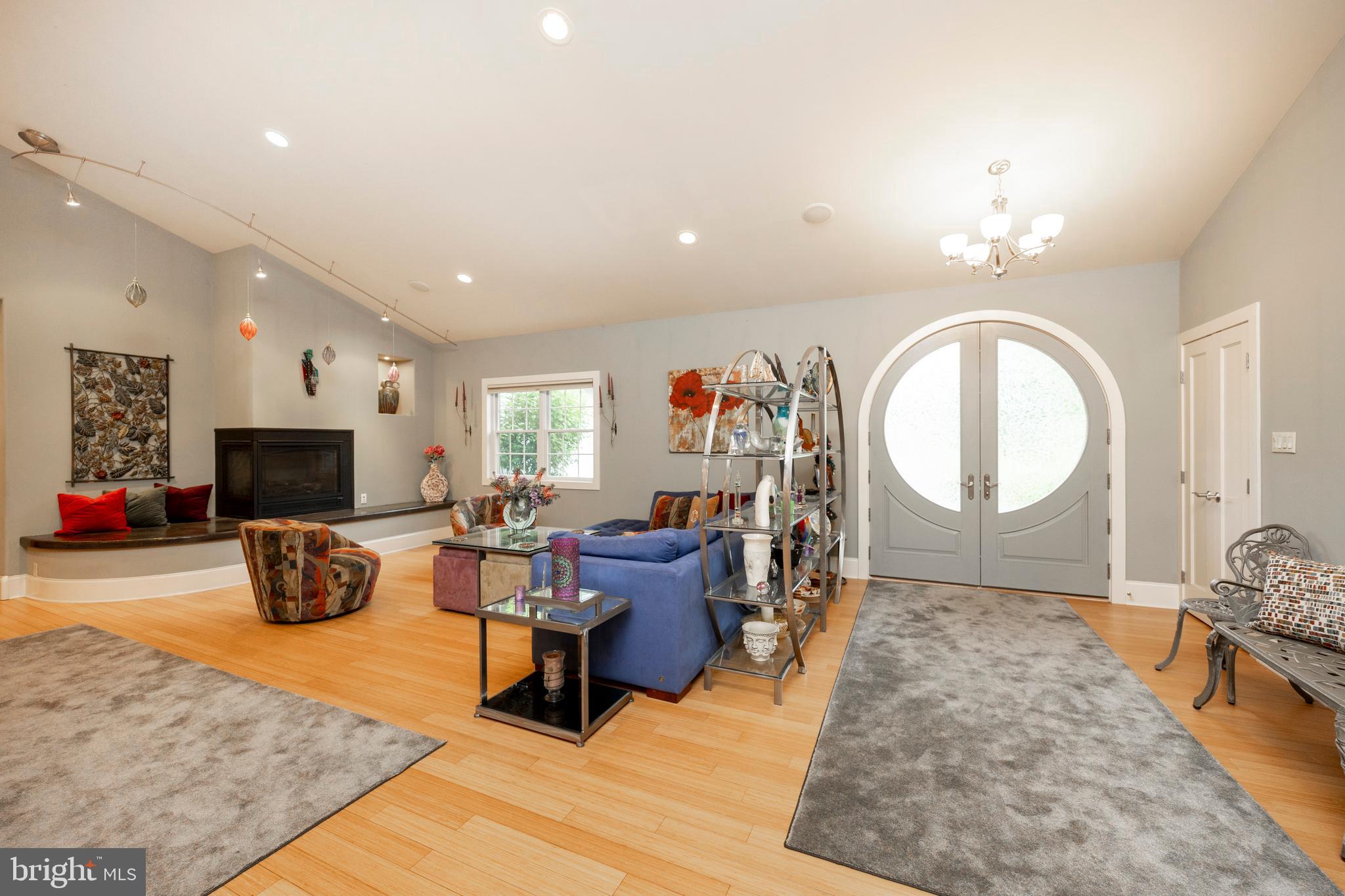 1720 St Peters Road Pottstown, PA 19465 - Photo 6 of 65 a living room with furniture a large window and a flat screen tv