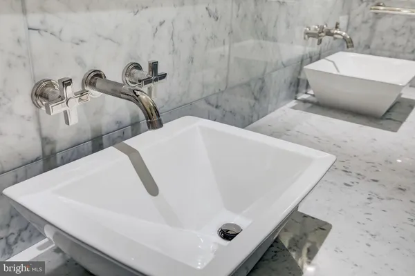 a bathroom with a tub and a sink