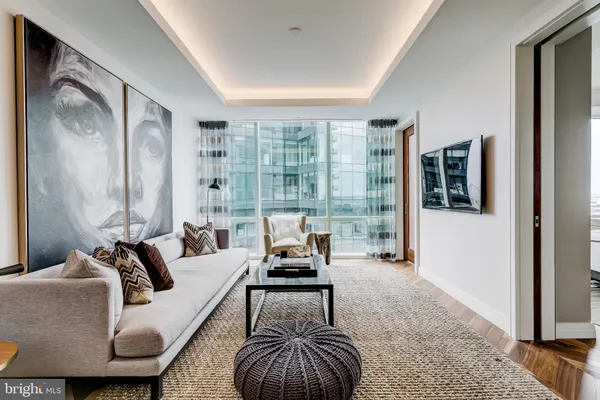 a living room with furniture and a large window