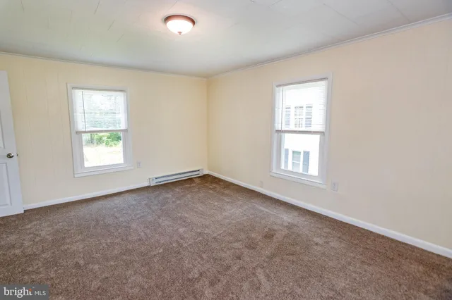 an empty room with windows