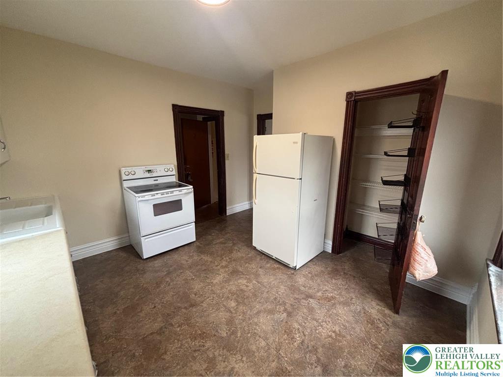 3629 Dorney Road Allentown, PA 18104 - Photo 4 of 8 a white refrigerator freezer sitting in a room