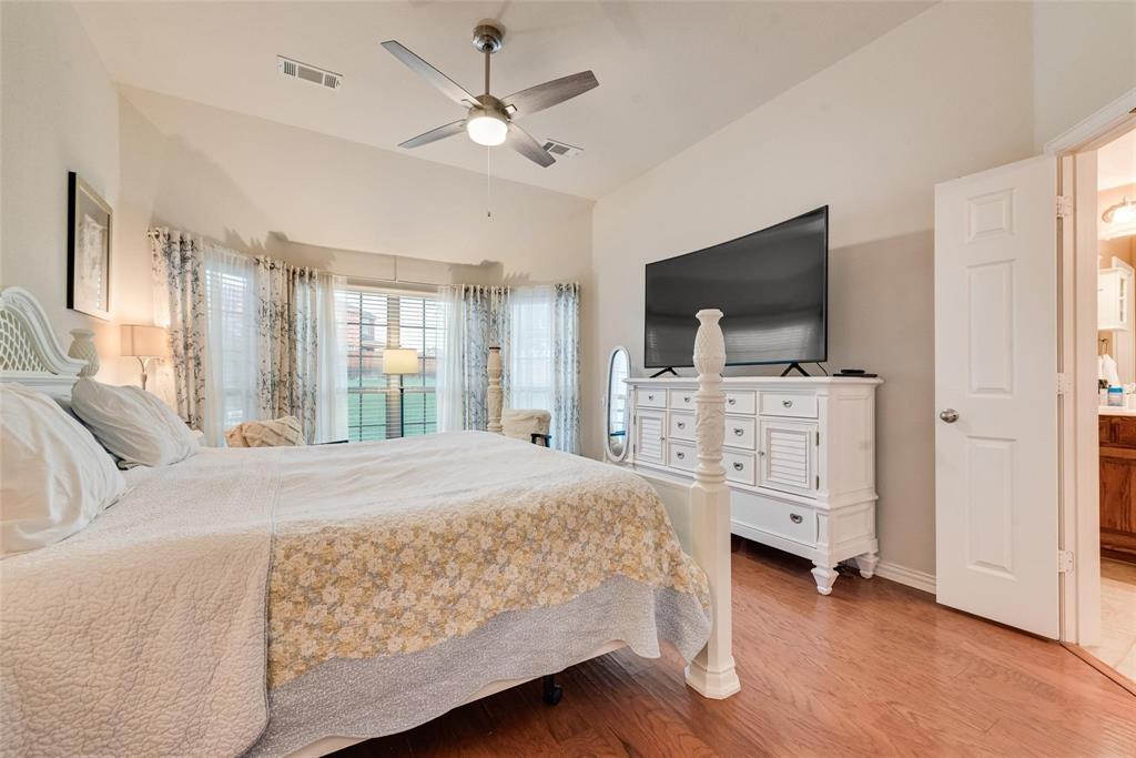 101 Cassandra Drive Forney, TX 75126 - Photo 12 of 21 a bedroom with a bed and a flat screen tv