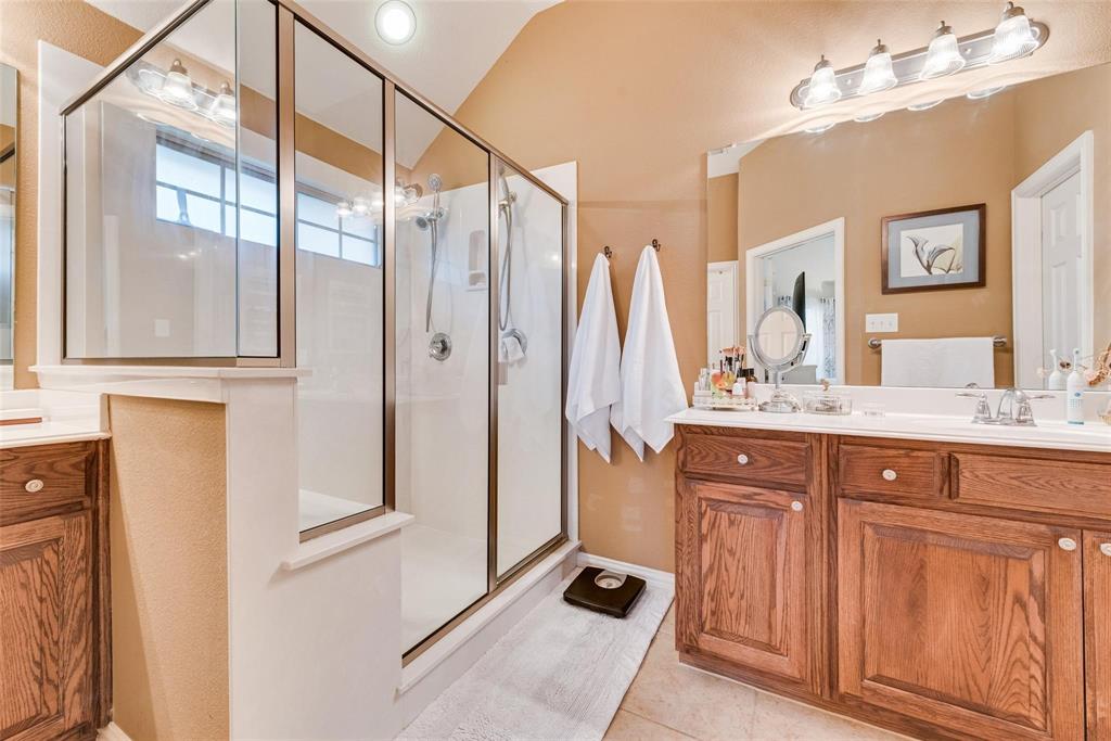 101 Cassandra Drive Forney, TX 75126 - Photo 13 of 21 a bathroom with a double vanity sink and mirror