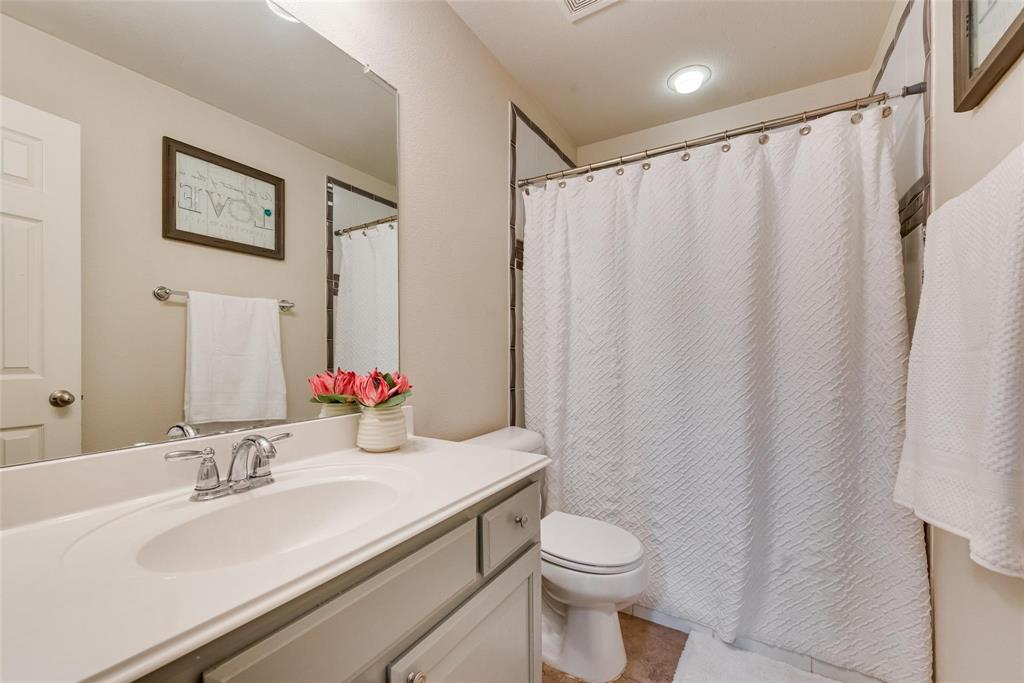 101 Cassandra Drive Forney, TX 75126 - Photo 17 of 21 a bathroom with a sink and a mirror