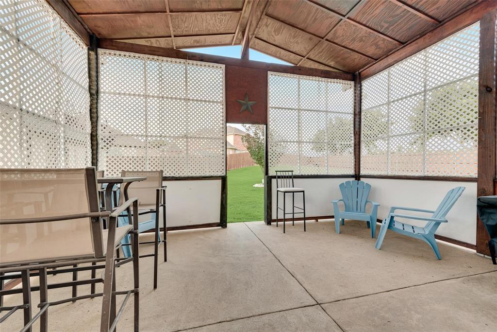 101 Cassandra Drive Forney, TX 75126 - Photo 18 of 21 a porch with a bench next to a window