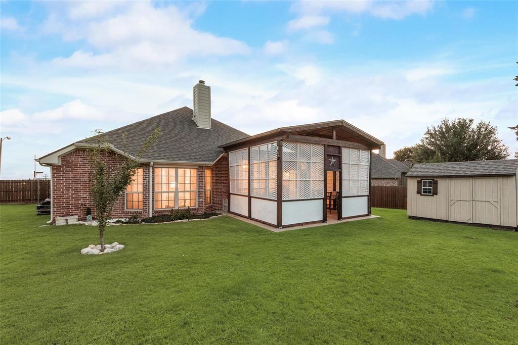 101 Cassandra Drive Forney, TX 75126 - Photo 19 of 21 a front view of a house with a yard