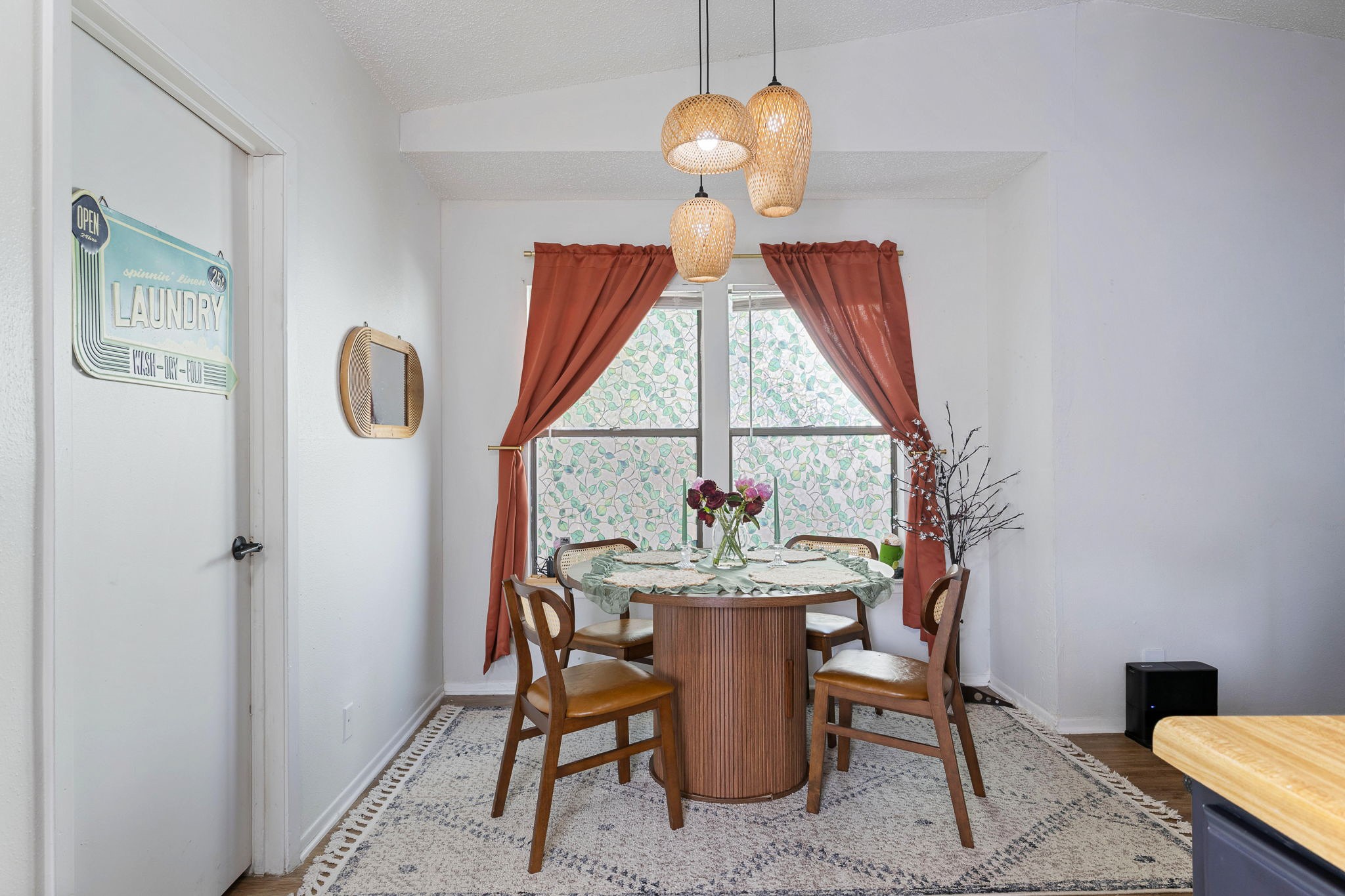 8317 Forest Ridge Drive San Antonio, TX 78239 - Photo 8 of 26 Natural light illuminates this cozy dining area, featuring a decorative rug and unique pendant lighting.