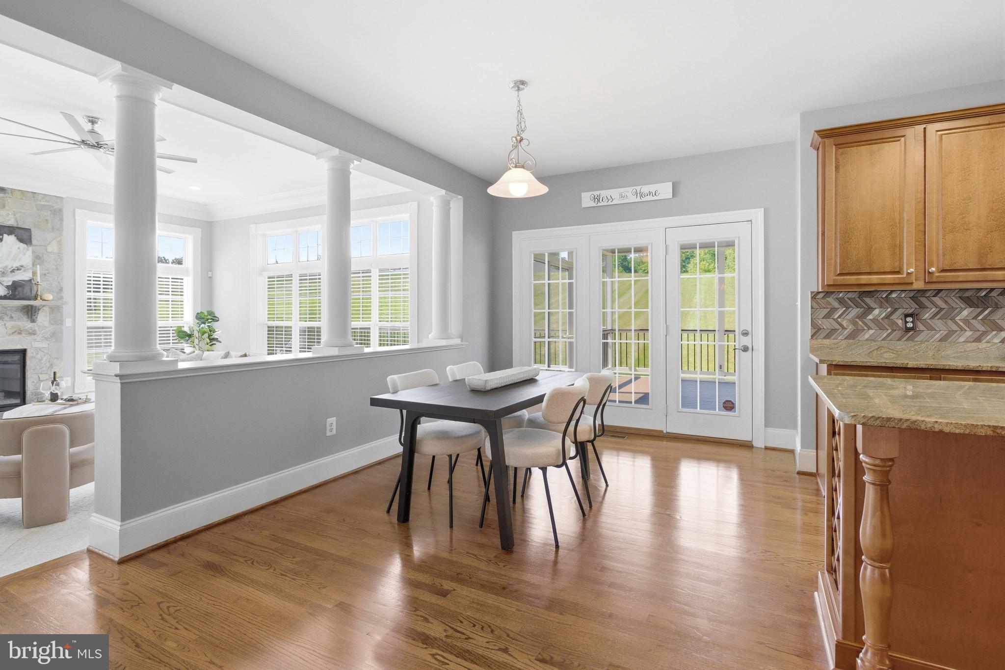 18475 Kerill Road Triangle, VA 22172 - Photo 48 of 99 a view of a dining room with furniture window and wooden floor